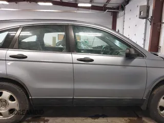 2009 Honda CR-V LX with VIN JHLRE48359C018488, listed as a IAAI auction lot 41824887 with 203,235 mi miles. Bid and sale history available at carsss.com. Image 13.
