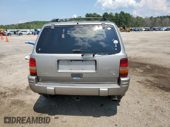 1998 Jeep Grand Cherokee Limited with VIN 1J4GZ88Z9WC148445, listed as a Copart auction lot 65961744 with 180,067 mi miles and Clean Title. Bid and sale history available at carsss.com. Image 6.