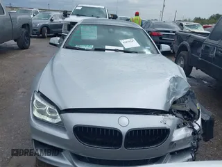 2015 BMW 6 Series 640i z VIN WBA6A0C51FD318982, wystawiony jako IAAI lot #41875547 z przebiegiem 60 968 mil mil oraz . Historia ofert i sprzedaży dostępna na DreamBid. Obrazek 12.