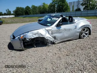 2012 Nissan 370Z Touring with VIN JN1AZ4FH3CM370910, listed as a Copart auction lot 65940005 with 23,009 mi miles and Salvage title. Bid and sale history available at DreamBid. Image 1.