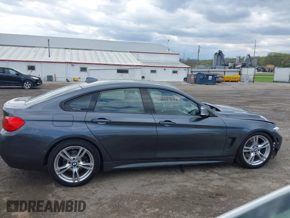 2015 BMW 4 Series 428i xDrive z VIN WBA4A7C5XFD415131, wystawiony jako IAAI lot #42100618 z przebiegiem 89 093 mil mil oraz . Historia ofert i sprzedaży dostępna na DreamBid. Obrazek 13.