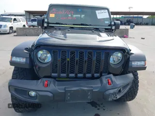 2021 Jeep Gladiator Rubicon z VIN 1C6JJTBG6ML535939, wystawiony jako IAAI lot #42260764 z przebiegiem 114 060 mil mil oraz . Historia ofert i sprzedaży dostępna na DreamBid. Obrazek 6.