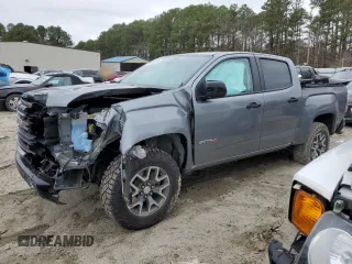 2022 GMC Canyon 4WD AT4 z VIN 1GTG6FENXN1274389, wystawiony jako Copart lot #85255404 z przebiegiem 42 843 mil mil oraz Szkoda całkowita • Salvage title. Historia ofert i sprzedaży dostępna na DreamBid. Obrazek 1.