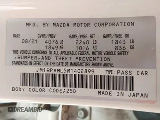 2021 Mazda 3 Premium z VIN JM1BPAML5M1402899, wystawiony jako IAAI lot #42252886 z przebiegiem Nie podano mil oraz . Historia ofert i sprzedaży dostępna na DreamBid. Obrazek 9.