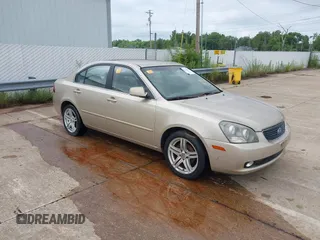 2006 Kia Optima LX z VIN KNAGE124465026311, wystawiony jako IAAI lot #42778935 z przebiegiem Nie podano mil oraz . Historia ofert i sprzedaży dostępna na DreamBid. Obrazek 1.