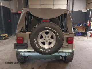 2004 Jeep Wrangler Sahara with VIN 1J4FA59S64P736389, listed as a IAAI auction lot 41432819 with 102,830 mi miles and . Bid and sale history available at DreamBid. Image 16.