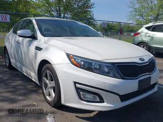 2015 Kia Optima LX with VIN KNAGM4A76F5663782, listed as a IAAI auction lot 42162942 with 128,321 mi miles. Bid and sale history available at carsss.com. Image 1.