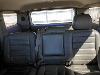2003 Hummer H2 z VIN 5GRGN23U33H102150, wystawiony jako Copart lot #56997295 z przebiegiem Nie podano mil oraz Tytuł czysty. Historia ofert i sprzedaży dostępna na DreamBid. Obrazek 10.