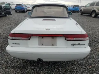 1991 Alfa Romeo Spider z VIN ZARBB32G8M6005213, wystawiony jako Copart lot #74077224 z przebiegiem Nie podano mil oraz Nie do naprawy. Historia ofert i sprzedaży dostępna na DreamBid. Obrazek 6.