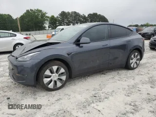 2023 Tesla Model Y Long Range z VIN 7SAYGAEE9PF854993, wystawiony jako Copart lot #55040345 z przebiegiem 53 620 mil mil oraz Szkoda całkowita • Salvage title. Historia ofert i sprzedaży dostępna na DreamBid. Obrazek 1.