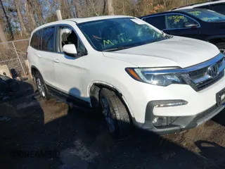 2021 Honda Pilot EX-L with VIN 5FNYF6H54MB020232, listed as a IAAI auction lot 41416780 with 99,667 mi miles. Bid and sale history available at carsss.com. Image 1.