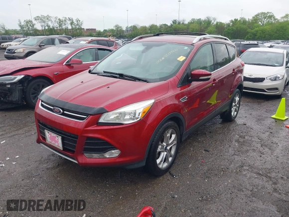 2014 Ford Escape Titanium with VIN 1FMCU0JX3EUD98815, listed as a IAAI auction lot 42078367 with 124,680 mi miles. Bid and sale history available at carsss.com. Image 2.