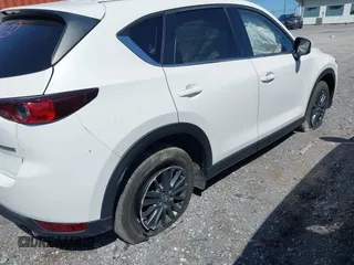 2021 Mazda CX-5 Touring z VIN JM3KFBCM2M1395663, wystawiony jako IAAI lot #41948073 z przebiegiem 47 029 mil mil oraz . Historia ofert i sprzedaży dostępna na DreamBid. Obrazek 6.