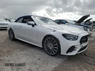 2021 Mercedes-Benz E 450 with VIN W1K1K5JB8MF157053, listed as a Copart auction lot 77119904 with 14,081 mi miles and Salvage title. Bid and sale history available at DreamBid. Image 4.