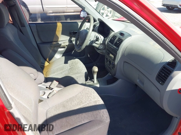 2003 Hyundai Accent GL with VIN KMHCG45C93U487209, listed as a IAAI auction lot 41590636 with 118,811 mi miles. Bid and sale history available at carsss.com. Image 5.
