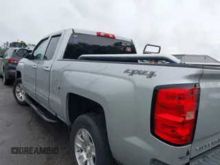 2018 Chevrolet Silverado 1500 LT with VIN 1GCVKREC7JZ151678, listed as a IAAI auction lot 41972011 with 106,892 mi miles and . Bid and sale history available at DreamBid. Image 14.