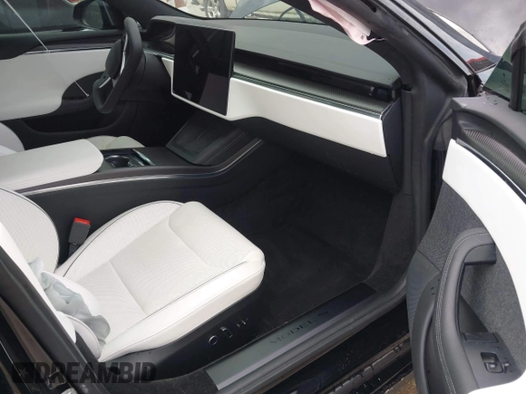 2022 Tesla Model S Plaid with VIN 5YJSA1E60NF460244, listed as a IAAI auction lot 41996403 with Not provided miles and . Bid and sale history available at DreamBid. Image 5.