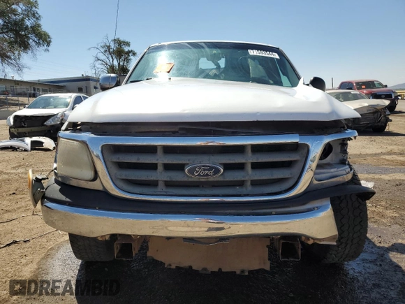 2000 Ford F-150 XL with VIN 1FTZF0727YKA84301, listed as a Copart auction lot 71593544 with 0 mi miles and Salvage Title. Bid and sale history available at carsss.com. Image 5.