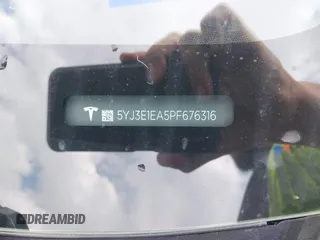 2023 Tesla Model 3 with VIN 5YJ3E1EA5PF676316, listed as a IAAI auction lot 42384765 with 33,715 mi miles and . Bid and sale history available at DreamBid. Image 9.