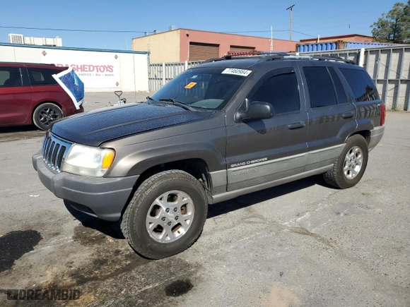 1999 Jeep Grand Cherokee Laredo with VIN 1J4GW58SXXC786179, listed as a Copart auction lot 79774564 with 272,192 mi miles and Salvage Title. Bid and sale history available at carsss.com. Image 1.