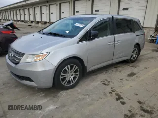 2012 Honda Odyssey EX-L with VIN 5FNRL5H60CB117376, listed as a Copart auction lot 50740725 with 163,716 mi miles and Salvage Title. Bid and sale history available at DreamBid. Image 1.
