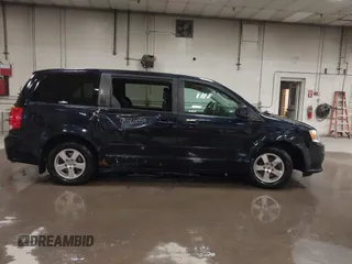 2011 Dodge Grand Caravan Mainstreet z VIN 2D4RN3DG2BR627795, wystawiony jako IAAI lot #42060059 z przebiegiem 91 442 mil mil oraz . Historia ofert i sprzedaży dostępna na DreamBid. Obrazek 13.
