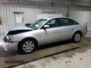 2005 Ford Five Hundred SEL with VIN 1FAFP24105G134791, listed as a Copart auction lot 59142295 with 148,115 mi miles and Salvage title. Bid and sale history available at DreamBid. Image 1.