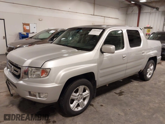 2009 Honda Ridgeline RTL with VIN 2HJYK16519H000129, listed as a IAAI auction lot 41891810 with 186,124 mi miles. Bid and sale history available at carsss.com. Image 2.