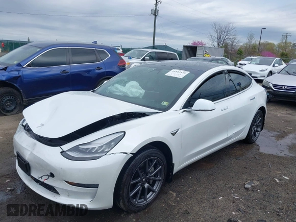 2019 Tesla Model 3 Mid Range with VIN 5YJ3E1EA5KF397098, listed as a IAAI auction lot 41943570 with 72,046 mi miles and . Bid and sale history available at DreamBid. Image 20.