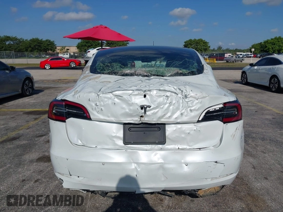 2020 Tesla Model 3 Standard Range Plus with VIN 5YJ3E1EA6LF799620, listed as a IAAI auction lot 42221643 with 55,458 mi miles and . Bid and sale history available at carsss.com. Image 6.