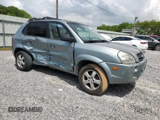 2005 Hyundai Tucson GL with VIN KM8JM12B05U148660, listed as a Copart auction lot 54302805 with 257,233 mi miles and Salvage title. Bid and sale history available at DreamBid. Image 4.