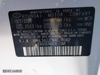 2021 Hyundai Sonata Hybrid SEL with VIN KMHL34JJ0MA024040, listed as a IAAI auction lot 41597221 with 54,891 mi miles. Bid and sale history available at carsss.com. Image 9.