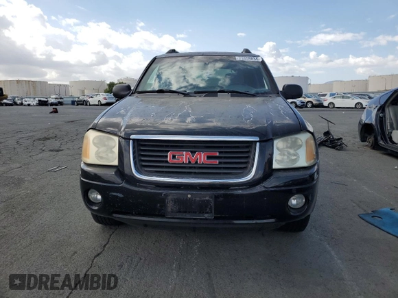 2003 GMC Envoy SLT with VIN 1GKES16SX36220489, listed as a Copart auction lot 71859834 with 148,811 mi miles and Salvage Title. Bid and sale history available at DreamBid. Image 5.
