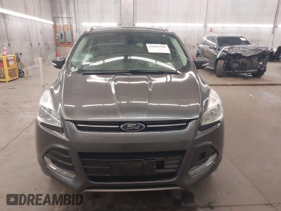 2015 Ford Escape Titanium with VIN 1FMCU9J96FUA43337, listed as a IAAI auction lot 41825328 with 149,639 mi miles and . Bid and sale history available at DreamBid. Image 13.
