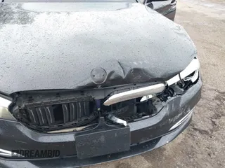 2018 BMW 5 Series 540i xDrive with VIN WBAJE7C59JWC55346, listed as a IAAI auction lot 42300109 with 107,868 mi miles and . Bid and sale history available at DreamBid. Image 6.