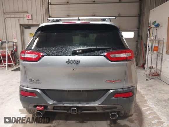 2014 Jeep Cherokee Trailhawk z VIN 1C4PJMBS4EW254963, wystawiony jako IAAI lot #42065845 z przebiegiem 187 356 mil mil oraz . Historia ofert i sprzedaży dostępna na DreamBid. Obrazek 16.