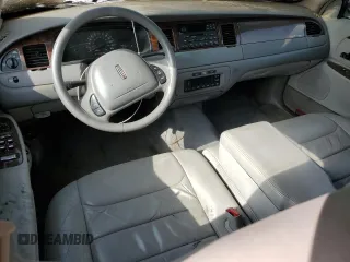 1999 Lincoln Town Car Executive z VIN 1LNHM81W0XY644873, wystawiony jako Copart lot #52865095 z przebiegiem Nie podano mil oraz Szkoda całkowita • Salvage title. Historia ofert i sprzedaży dostępna na DreamBid. Obrazek 8.