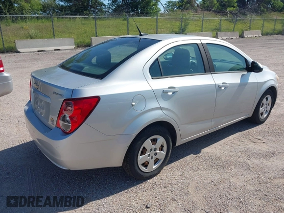 2013 Chevrolet Sonic LS with VIN 1G1JA5SH1D4246936, listed as a IAAI auction lot 42665664 with 124,464 mi miles and . Bid and sale history available at DreamBid. Image 4.