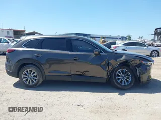 2019 Mazda CX-9 Touring with VIN JM3TCACY9K0304899, listed as a IAAI auction lot 42167180 with 57,043 mi miles and . Bid and sale history available at DreamBid. Image 13.
