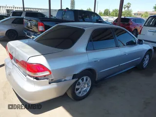 2002 Honda Accord SE z VIN JHMCG66892C011913, wystawiony jako IAAI lot #42323509 z przebiegiem 226 288 mil mil oraz . Historia ofert i sprzedaży dostępna na DreamBid. Obrazek 4.