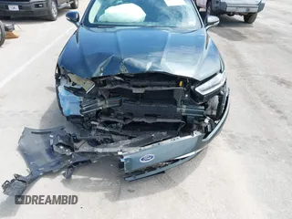 2015 Ford Fusion SE Hybrid with VIN 3FA6P0LU7FR224823, listed as a IAAI auction lot 42199479 with 81,835 mi miles and . Bid and sale history available at DreamBid. Image 6.