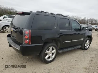 2014 Chevrolet Tahoe LTZ z VIN 1GNSCCE04ER156563, wystawiony jako Copart lot #44647735 z przebiegiem 135 849 mil mil oraz Czysty tytuł • Clean title. Historia ofert i sprzedaży dostępna na DreamBid. Obrazek 3.