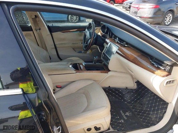 2014 Maserati Quattroporte S Q4 with VIN ZAM56RRA5E1113783, listed as a IAAI auction lot 40497812 with 100,036 mi miles. Bid and sale history available at carsss.com. Image 5.