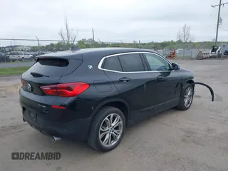 2018 BMW X2 xDrive28i with VIN WBXYJ5C34JEF72637, listed as a IAAI auction lot 42064330 with 96,725 mi miles. Bid and sale history available at carsss.com. Image 4.