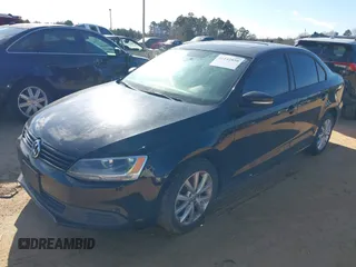 2012 Volkswagen Jetta Sedan SE w/Convenience with VIN 3VWDX7AJ5CM346105, listed as a IAAI auction lot 41142859 with 208,923 mi miles. Bid and sale history available at carsss.com. Image 2.