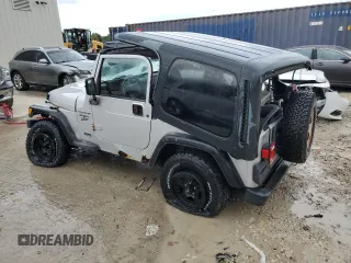 2002 Jeep Wrangler Sport with VIN 1J4FA49S32P733909, listed as a Copart auction lot 72776204 with 157,508 mi miles and Non Repairable. Bid and sale history available at carsss.com. Image 2.