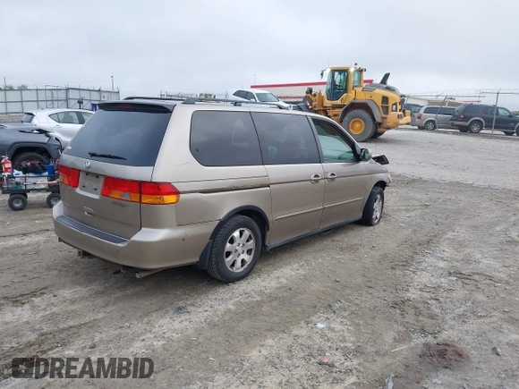 2003 Honda Odyssey EX z VIN 2HKRL18683H505577, wystawiony jako IAAI lot #42118231 z przebiegiem 234 329 mil mil oraz . Historia ofert i sprzedaży dostępna na DreamBid. Obrazek 4.