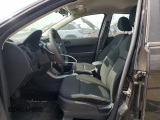 2008 Ford Focus SE z VIN 1FAHP35NX8W215744, wystawiony jako Copart lot #56096055 z przebiegiem 165 827 mil mil oraz Szkoda całkowita • Salvage title. Historia ofert i sprzedaży dostępna na DreamBid. Obrazek 7.