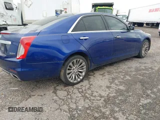 2014 Cadillac CTS Luxury RWD with VIN 1G6AR5SX9E0155626, listed as a IAAI auction lot 41271029 with 99,038 mi miles. Bid and sale history available at carsss.com. Image 4.