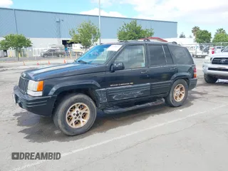1996 Jeep Grand Cherokee Limited z VIN 1J4GZ78Y3TC191000, wystawiony jako IAAI lot #42259621 z przebiegiem 212 690 mil mil oraz . Historia ofert i sprzedaży dostępna na DreamBid. Obrazek 17.